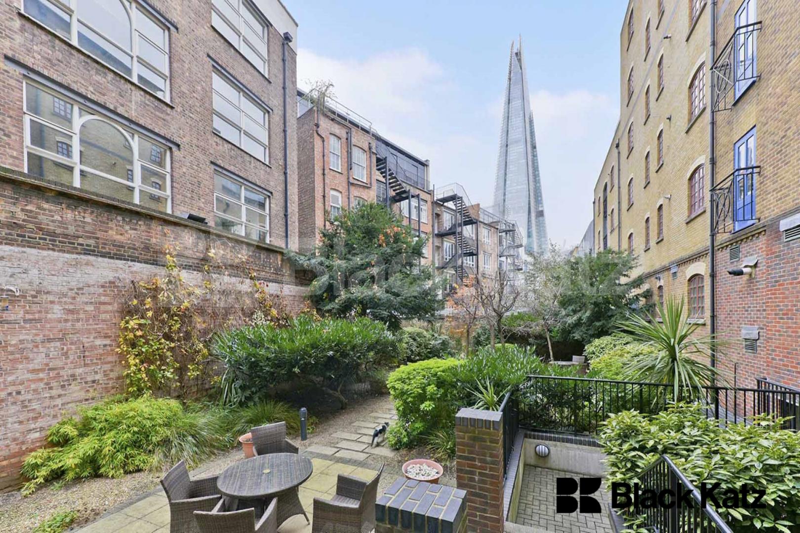 Warehouse style apartment with 900 sq. ft. of living and entertaining space Lion Court.  Shand Street, London Bridge